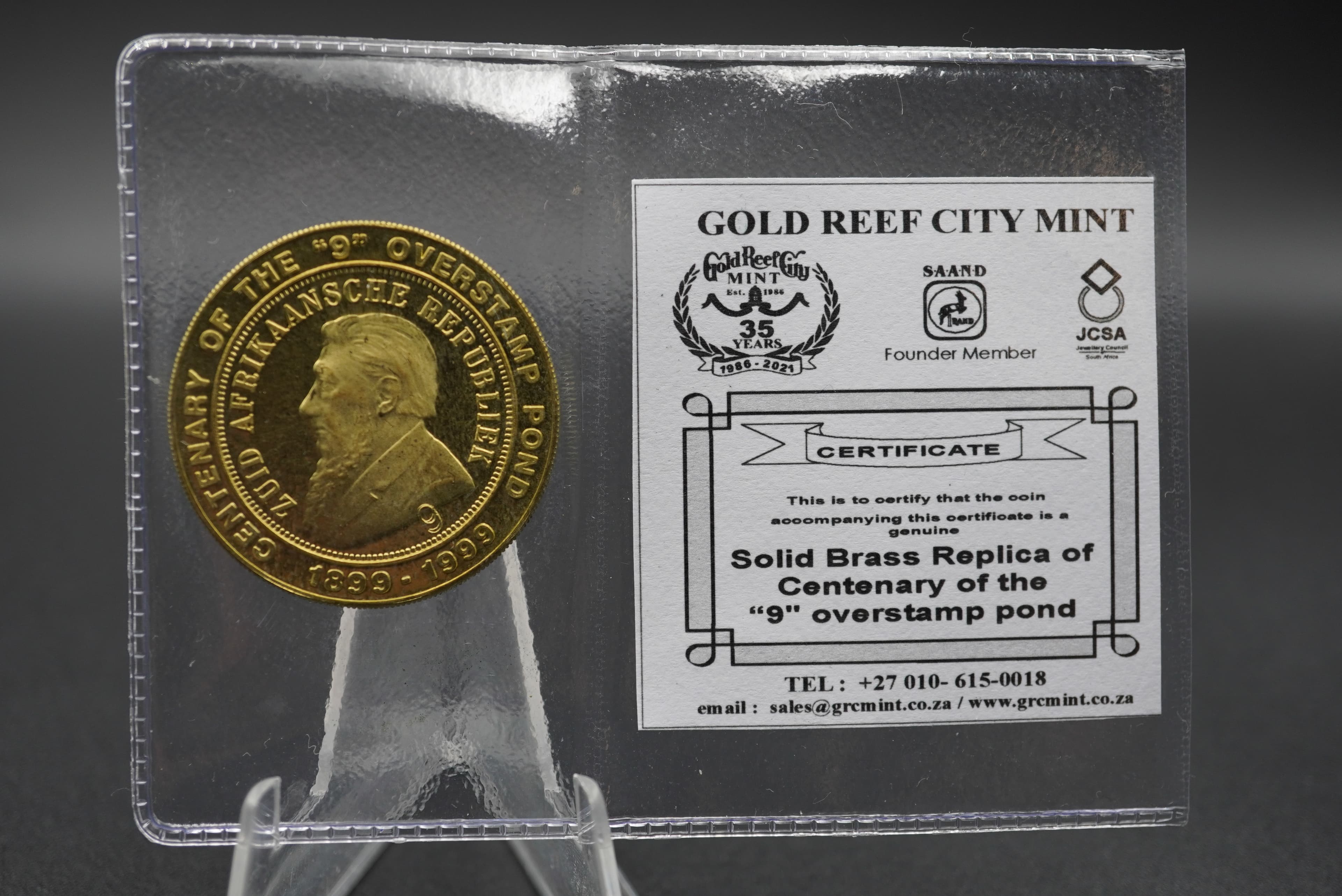 GRC solid brass replica of centenary of the '9' overstamp pond coin