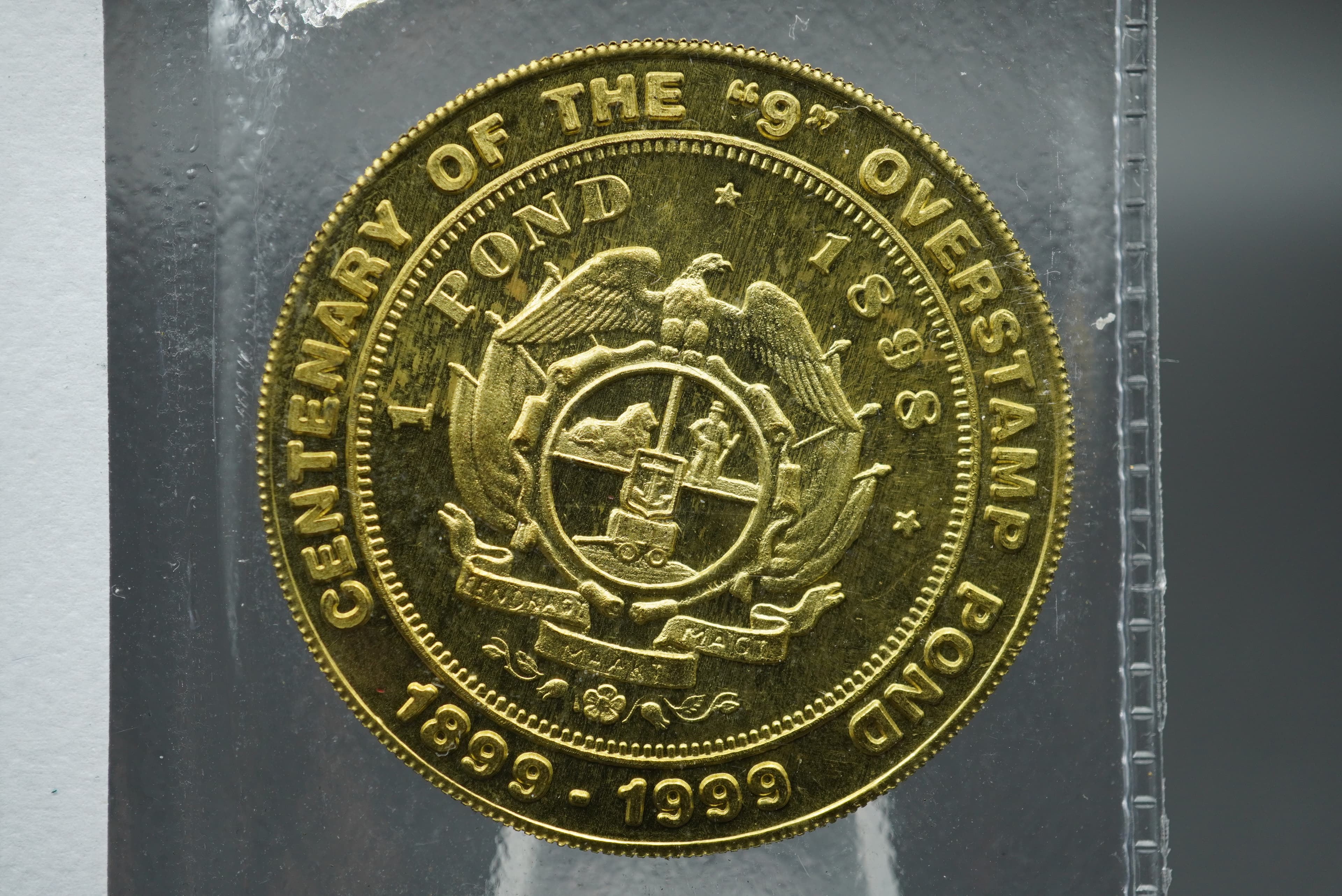 GRC solid brass replica of centenary of the '9' overstamp pond coin